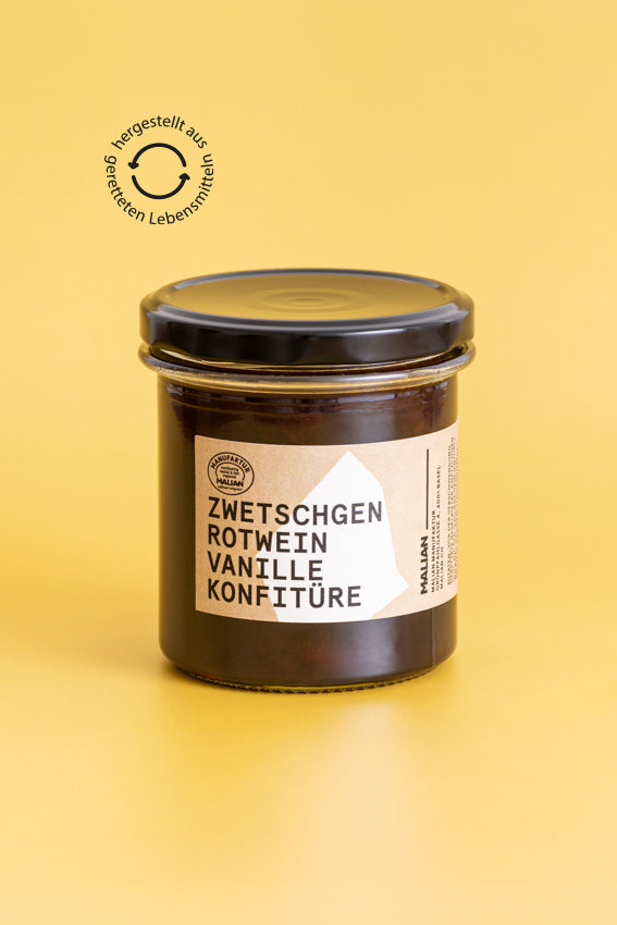 Ein Glas ZwetschgenKonfitüre mit Rotwein und Vanille. Handgemacht in Basel aus Food Waste.